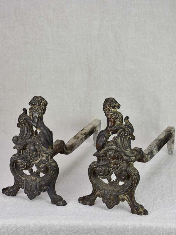 Antique French andirons with lions decoration