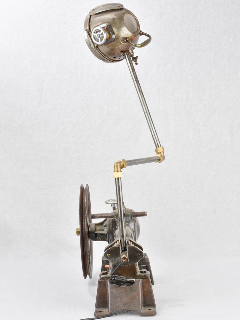 Salvaged pump and motorbike table lamp