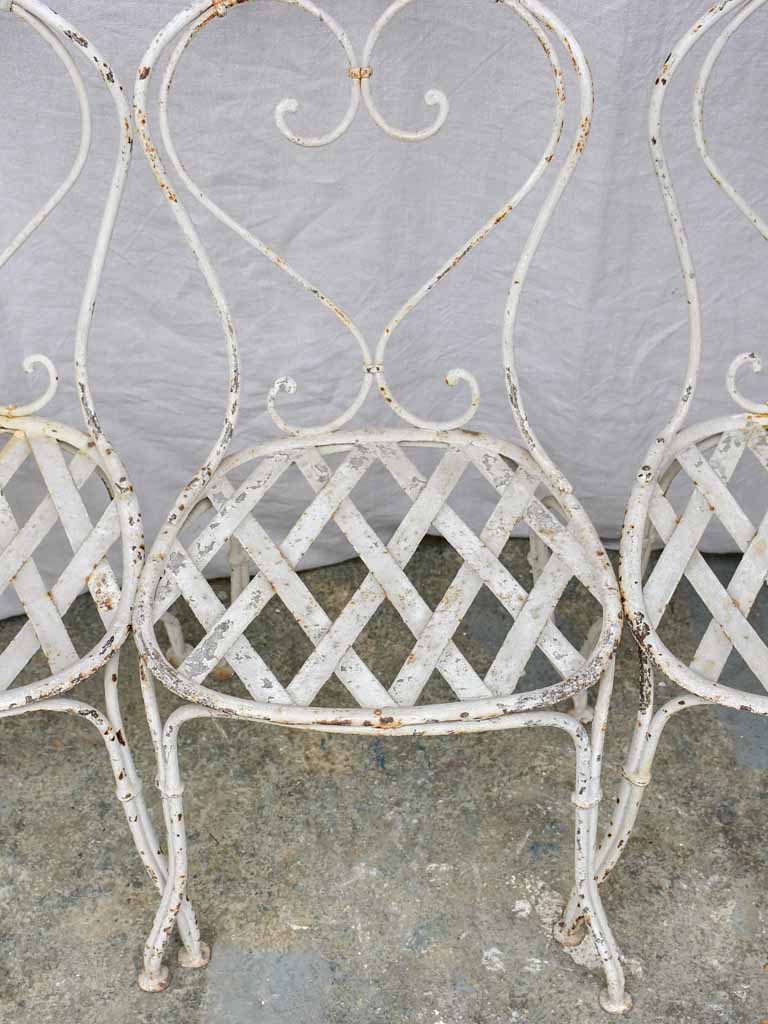 Four antique French garden chairs with heart back and lattice seat
