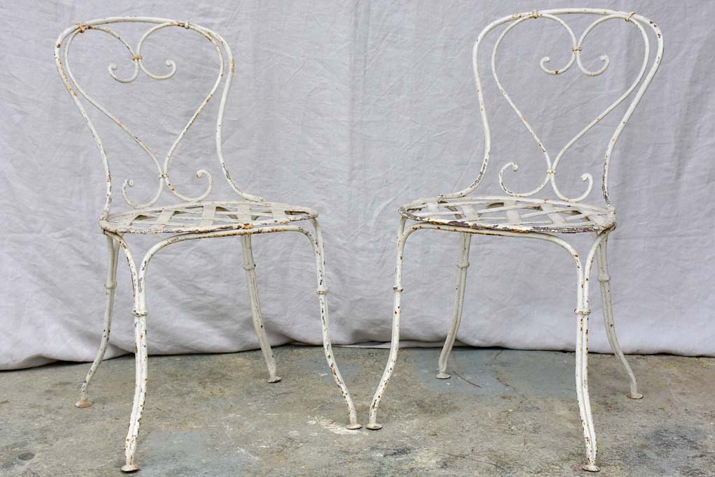 Four antique French garden chairs with heart back and lattice seat