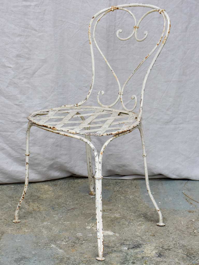 Four antique French garden chairs with heart back and lattice seat
