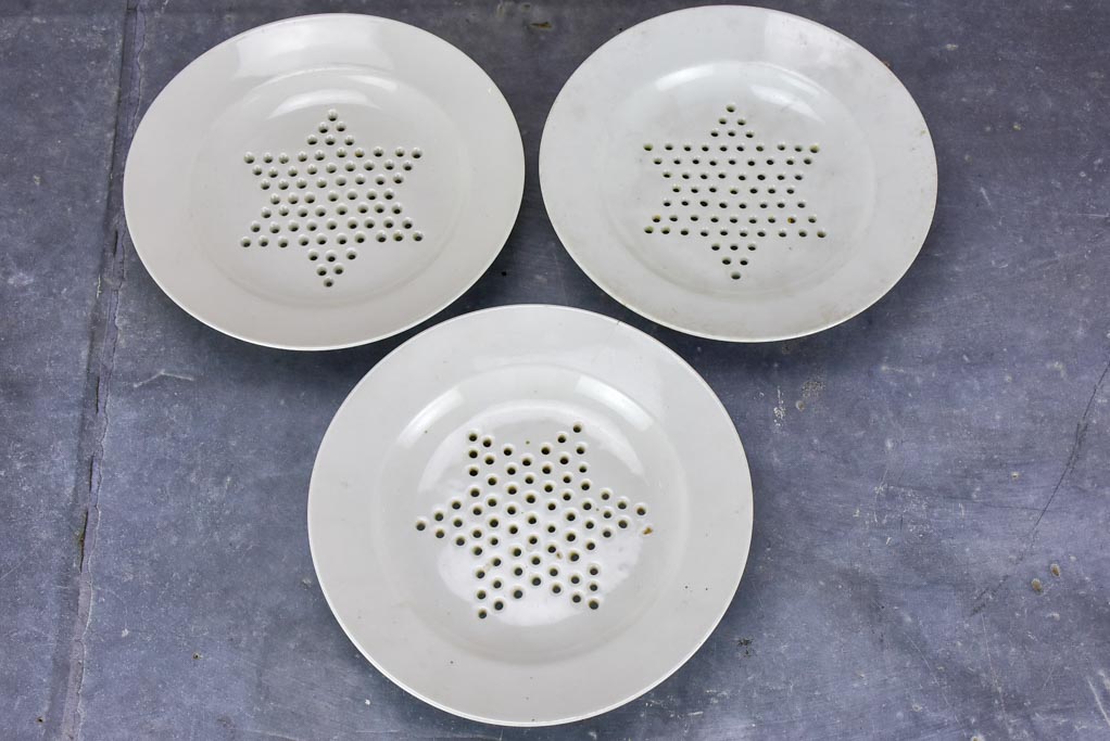 Set of three Directoire fruit strainer plates with claw feet