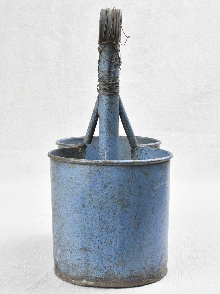 Antique bottle carrier with blue patina