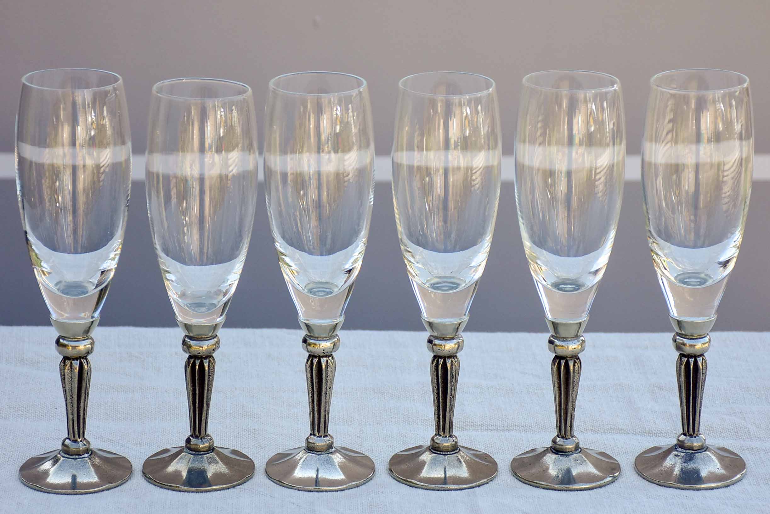 Six French mid-century crystal champagne flutes with pewter detail - signed