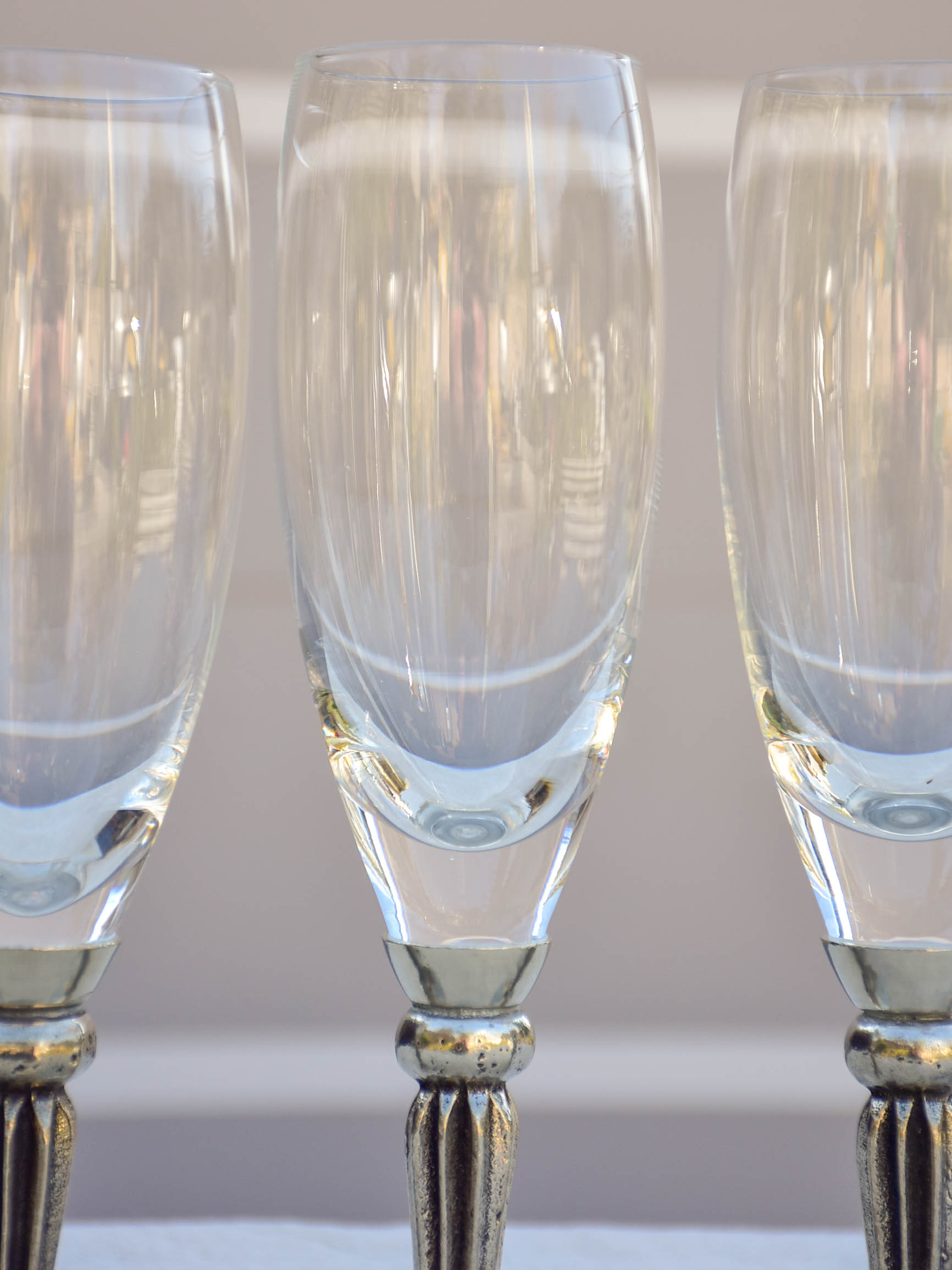 Six French mid-century crystal champagne flutes with pewter detail - signed