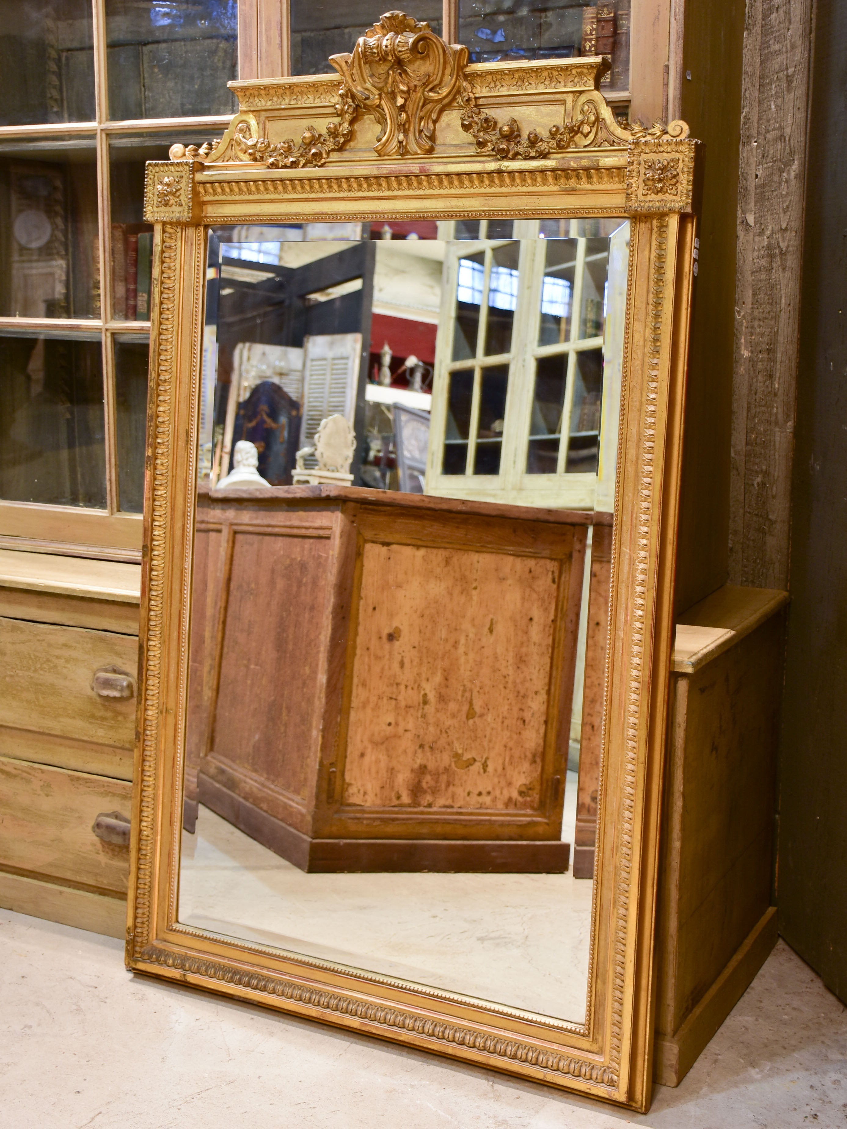 Antique French Napoleon III mirror with gilded frame and crest