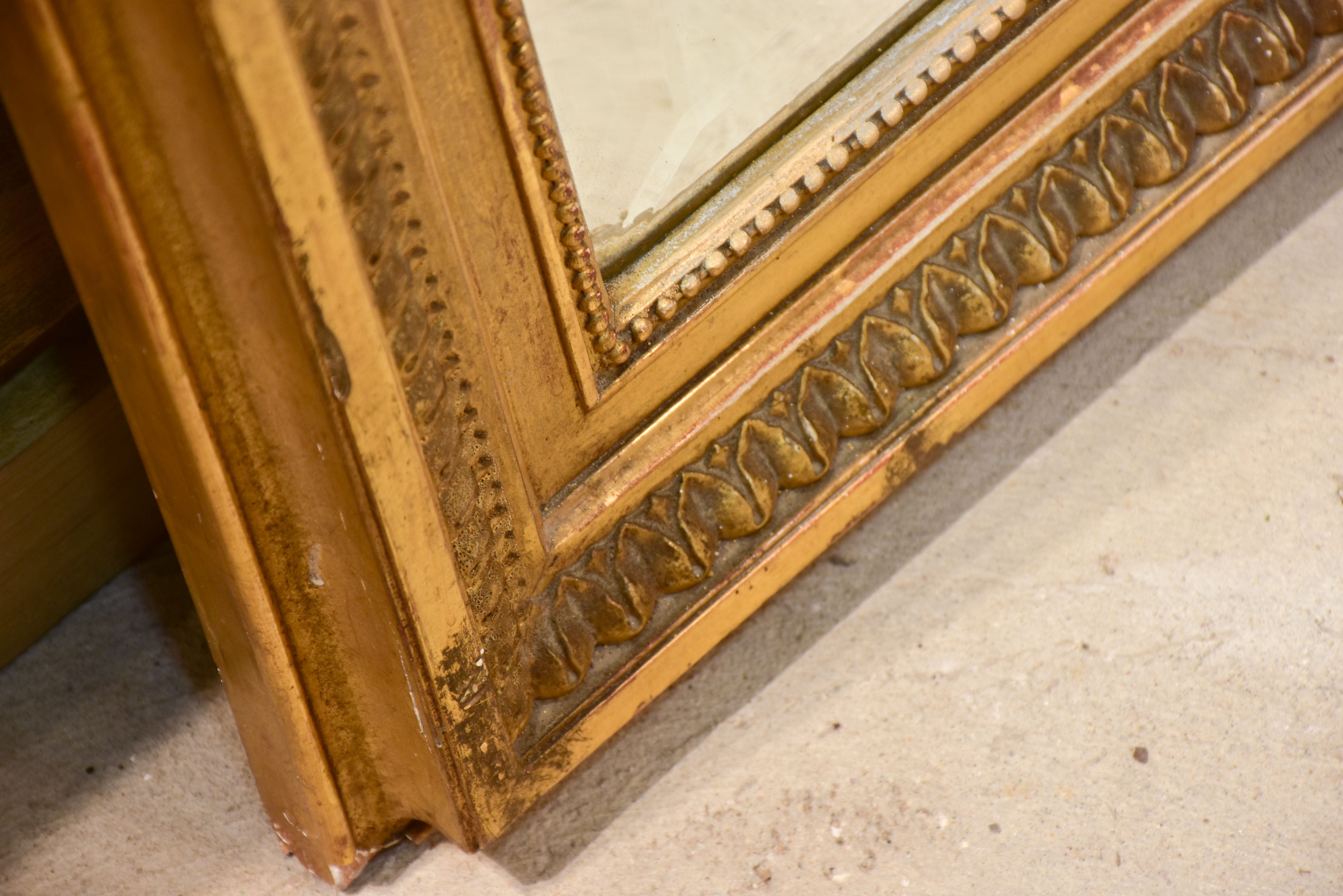 Antique French Napoleon III mirror with gilded frame and crest
