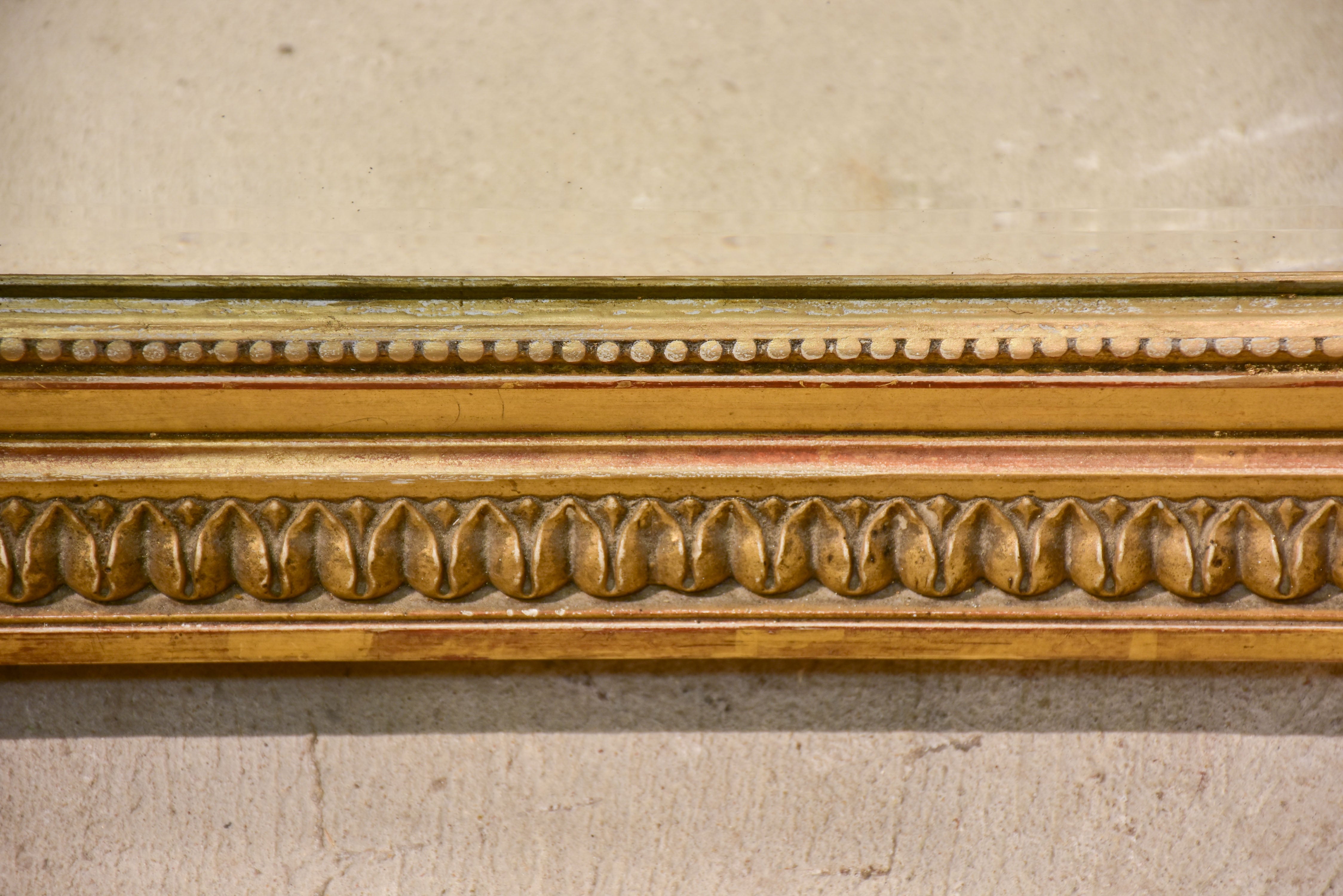 Antique French Napoleon III mirror with gilded frame and crest