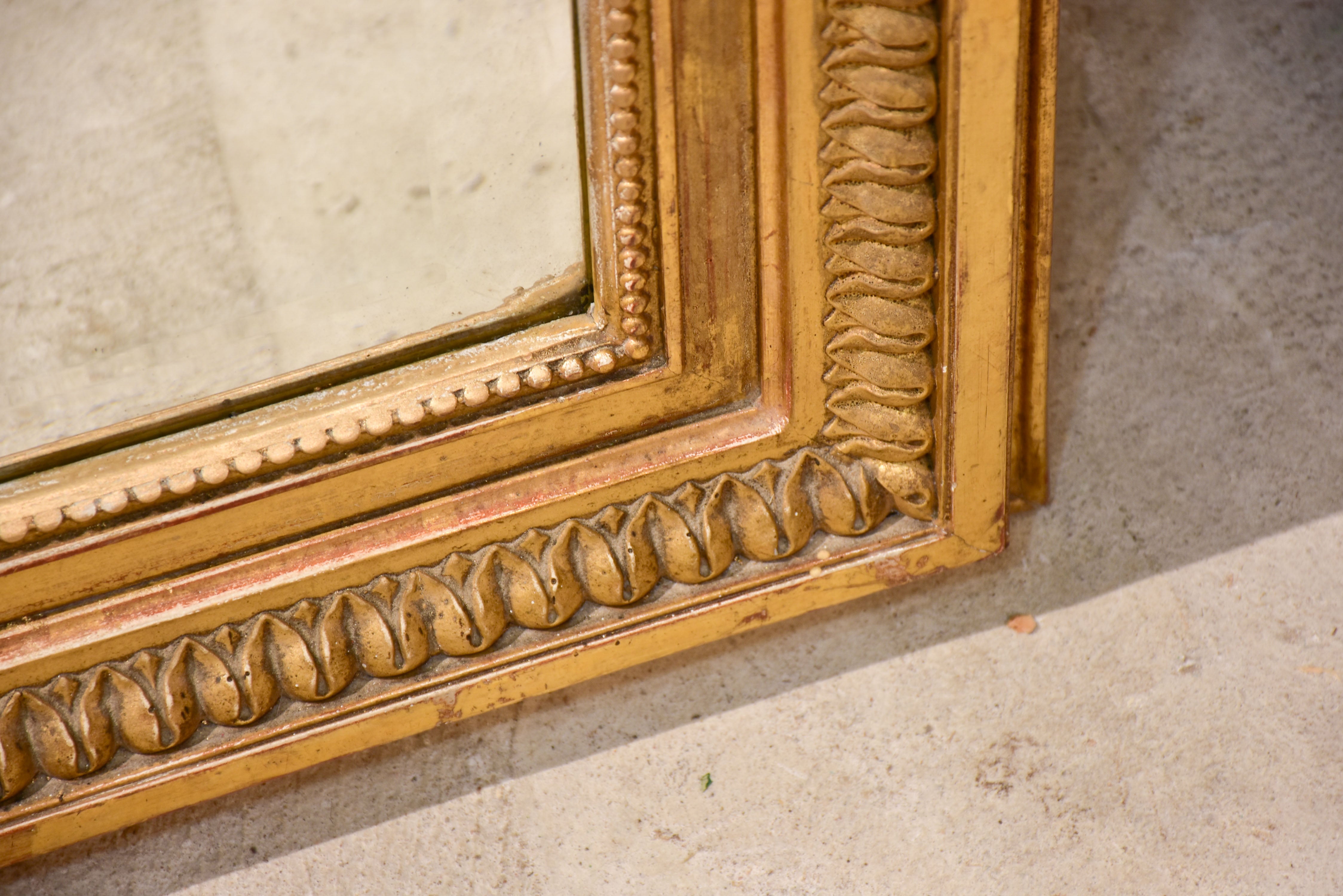 Antique French Napoleon III mirror with gilded frame and crest