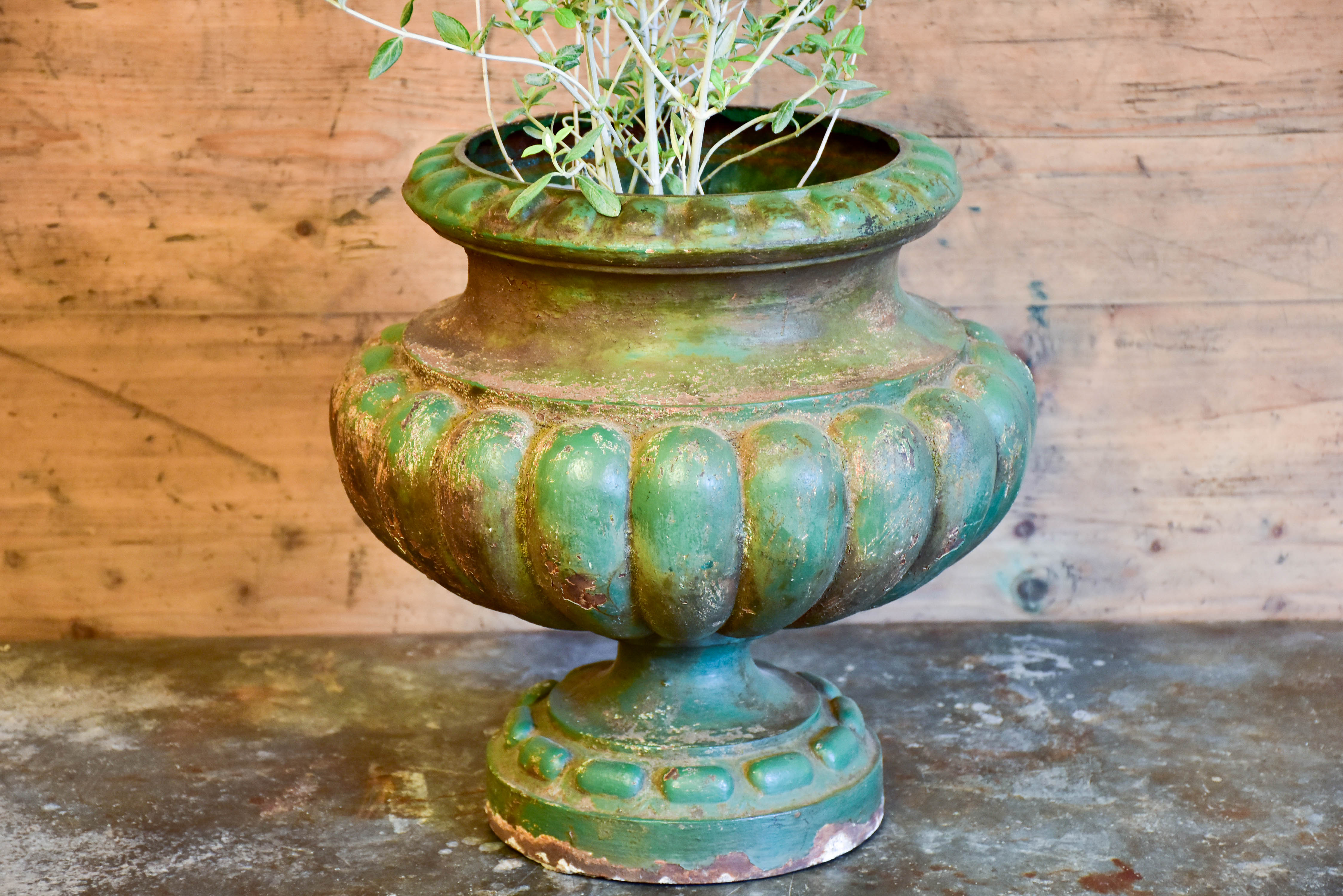 Antique French garden urn with green patina