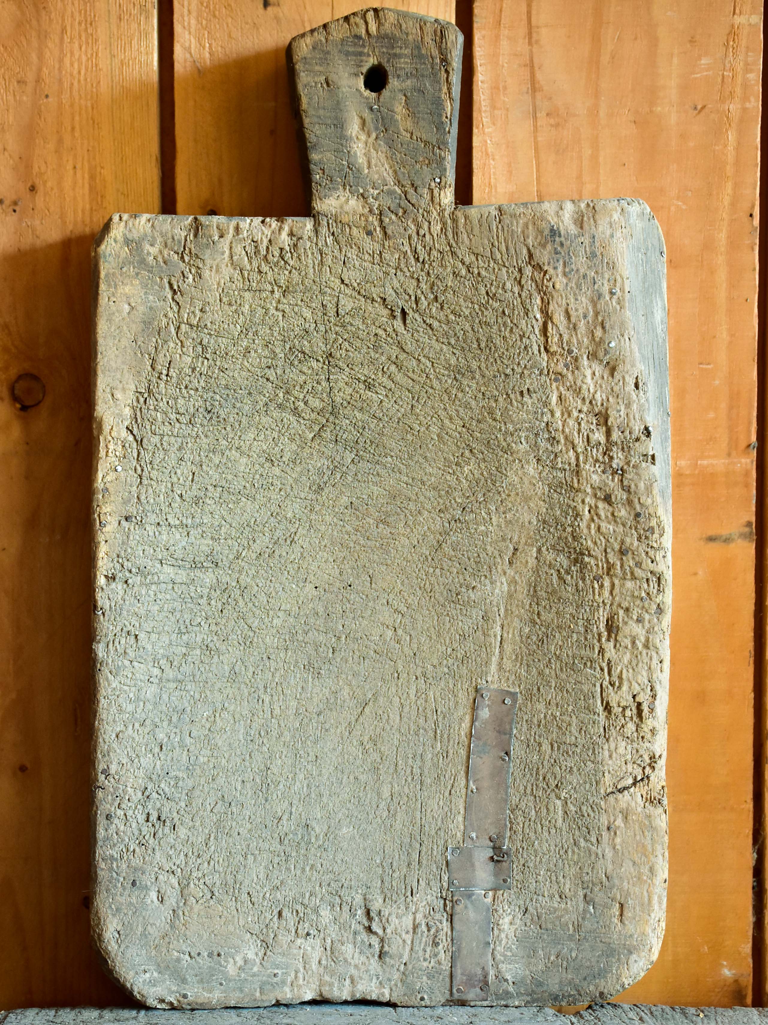 Very rustic cutting board with repairs