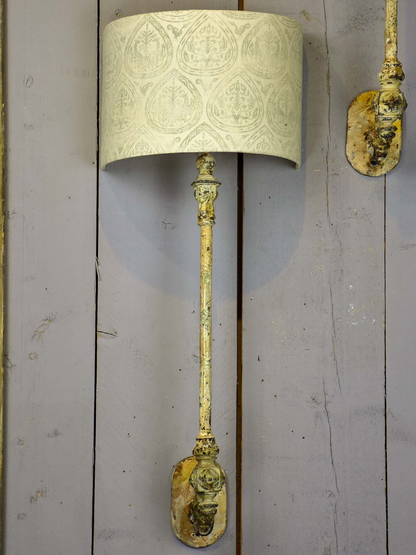 Pair of cast iron wall appliques made from salvaged balusters