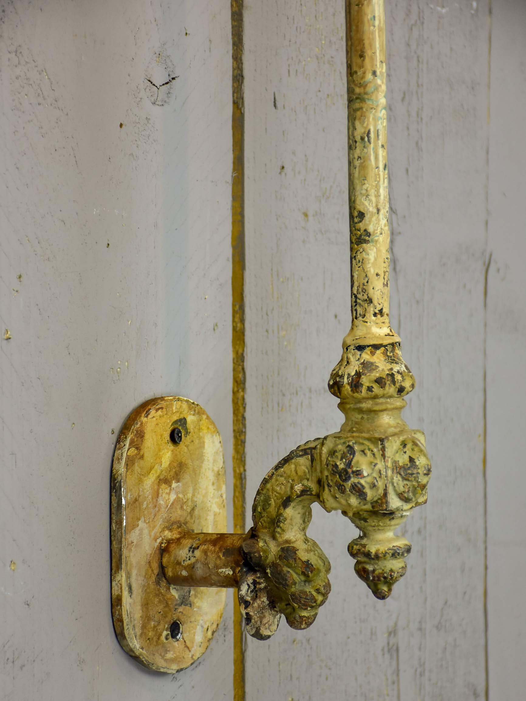 Pair of cast iron wall appliques made from salvaged balusters