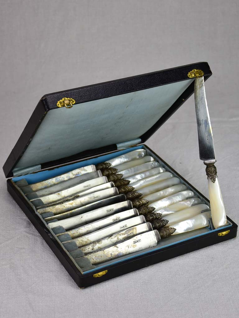 Set of 12 antique Parisian knives with mother of pearl handles and carbon steel blades