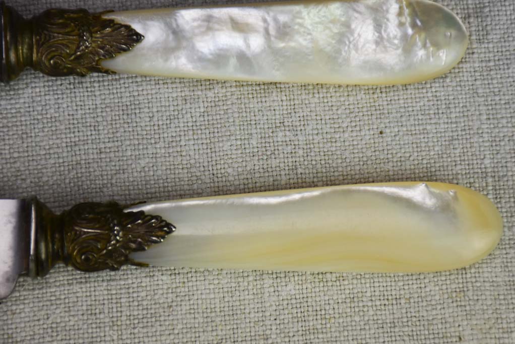 Set of 12 antique Parisian knives with mother of pearl handles and carbon steel blades