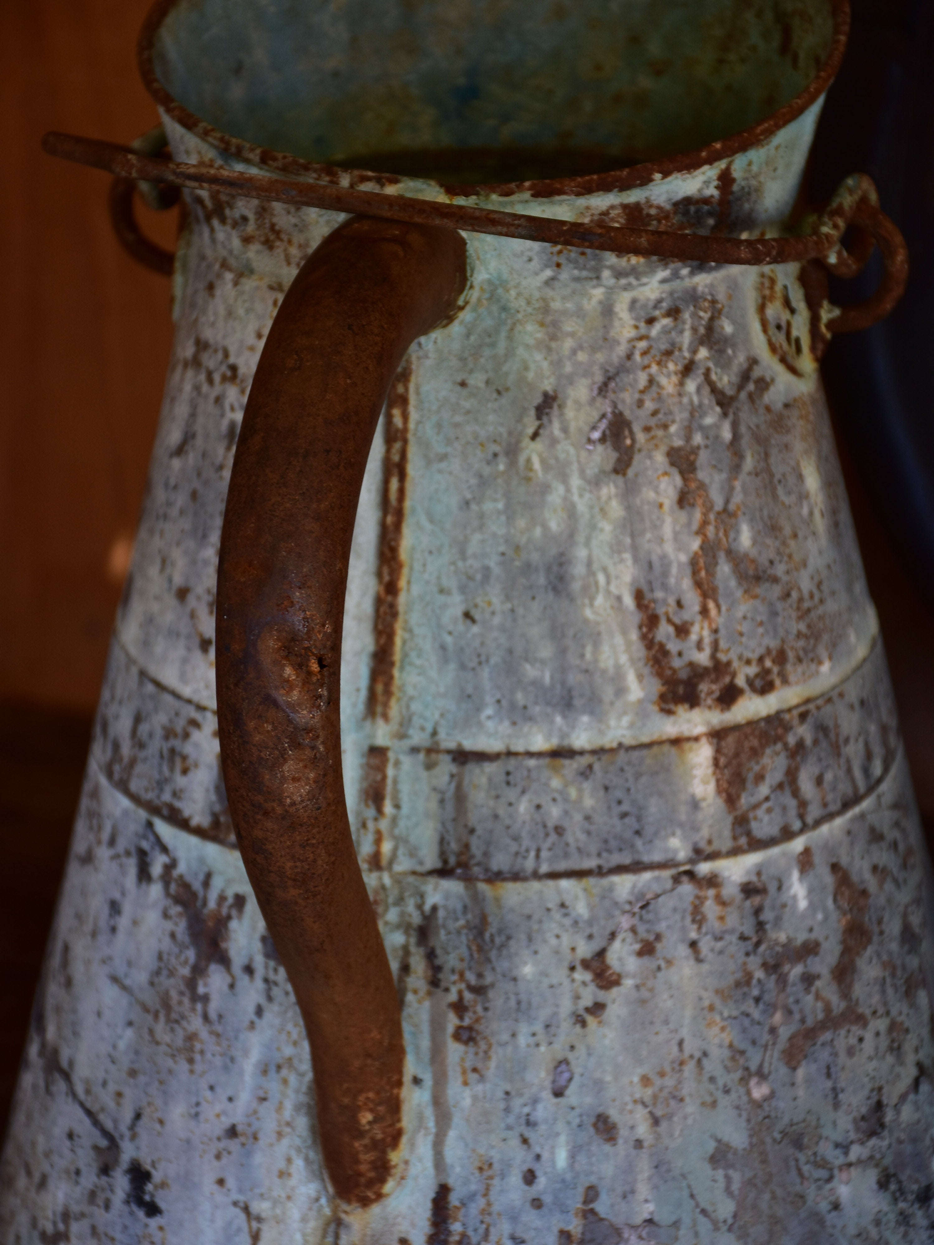 Antique French watering can with aqua patina