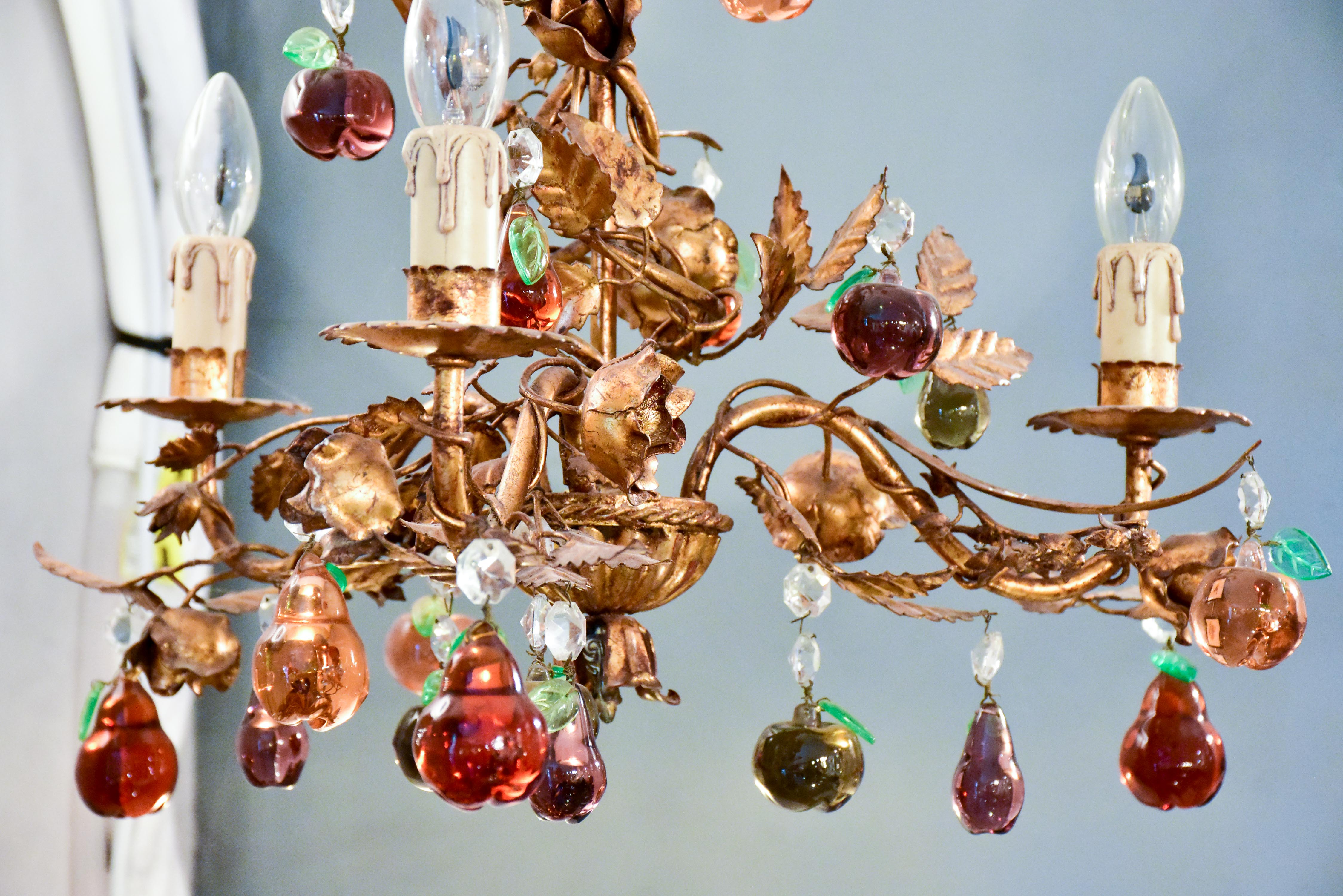 Vintage Italian chandelier with Murano glass fruits and a decorative gilded frame
