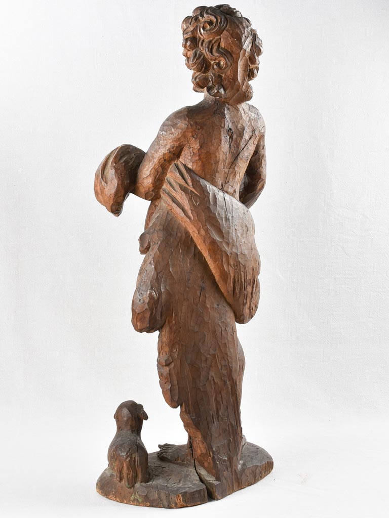 Aged wooden John Baptist carving
