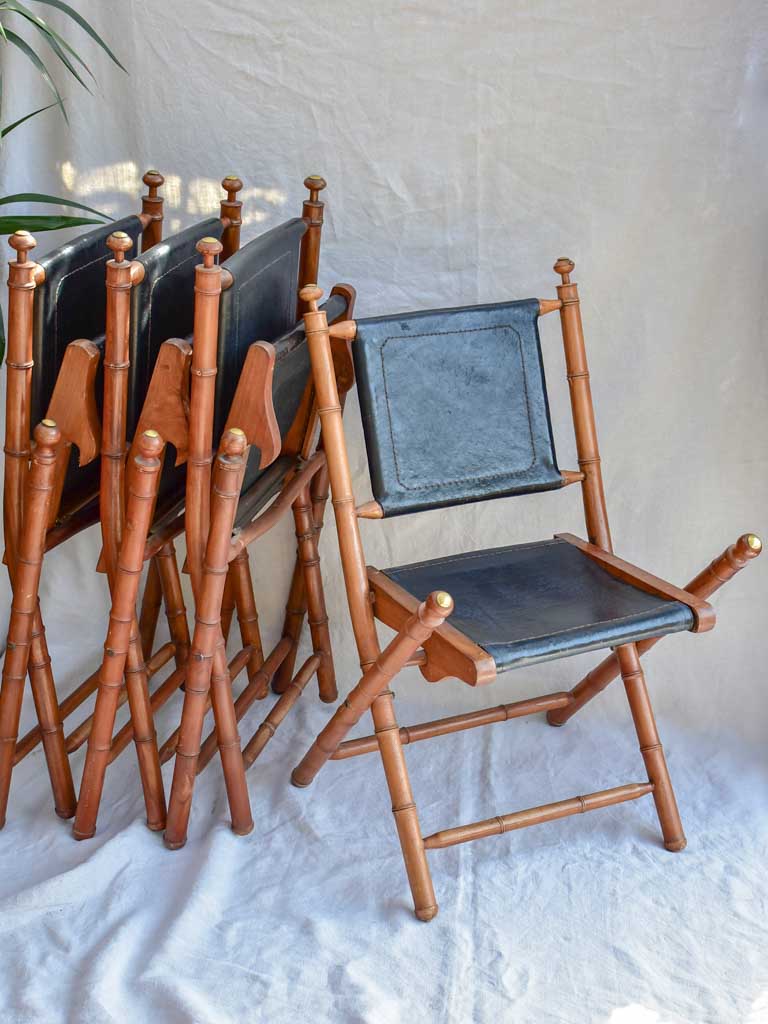 Four antique French colonial folding leather boat deck chairs