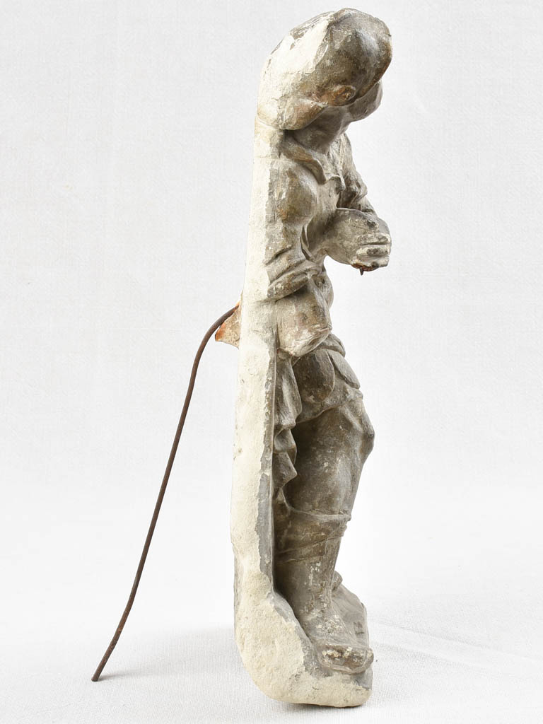 Aged warrior statue, iron supported