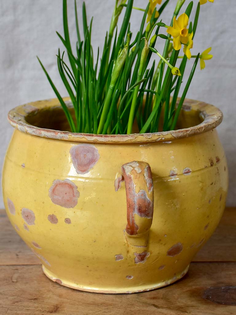 Antique French chamber pot with pale yellow glaze