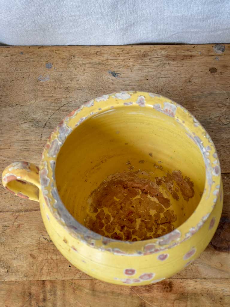 Antique French chamber pot with pale yellow glaze