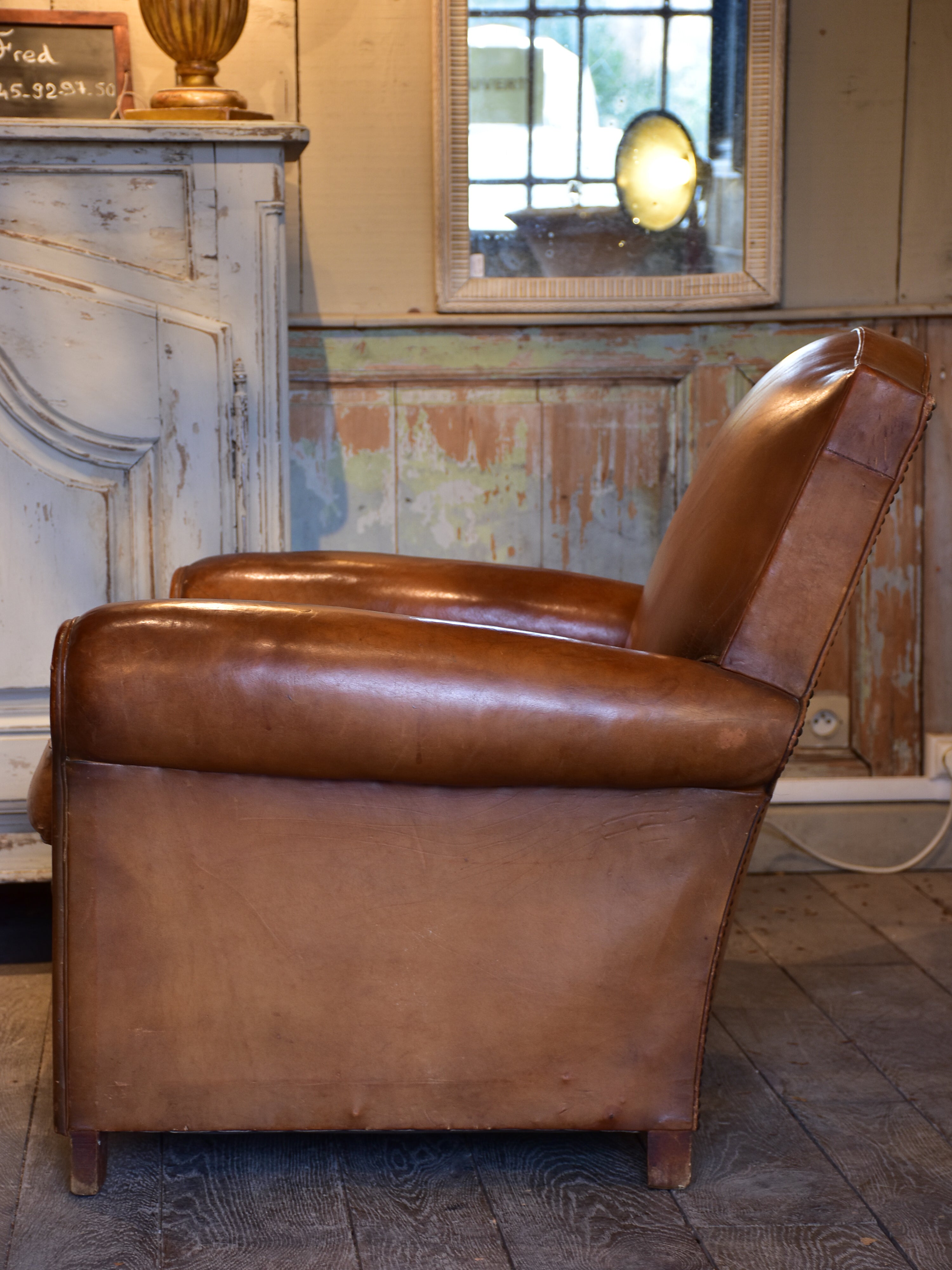 Vintage French leather club chair in original condition