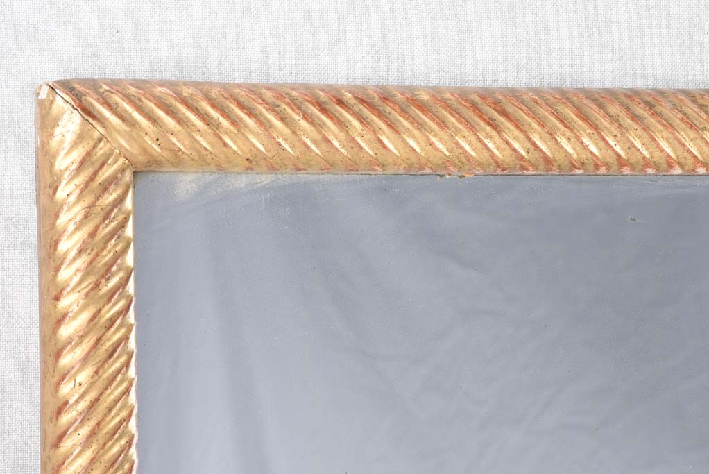 Louis XVI gilded mirror with spiraling frame 32¾" x 57"