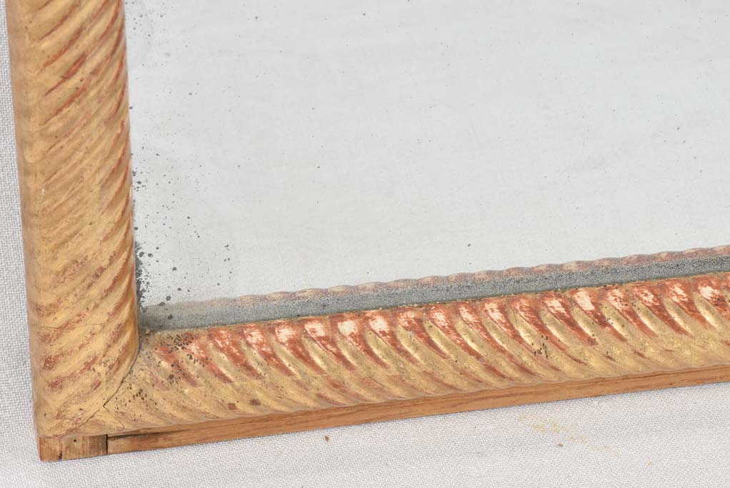 Louis XVI gilded mirror with spiraling frame 32¾" x 57"