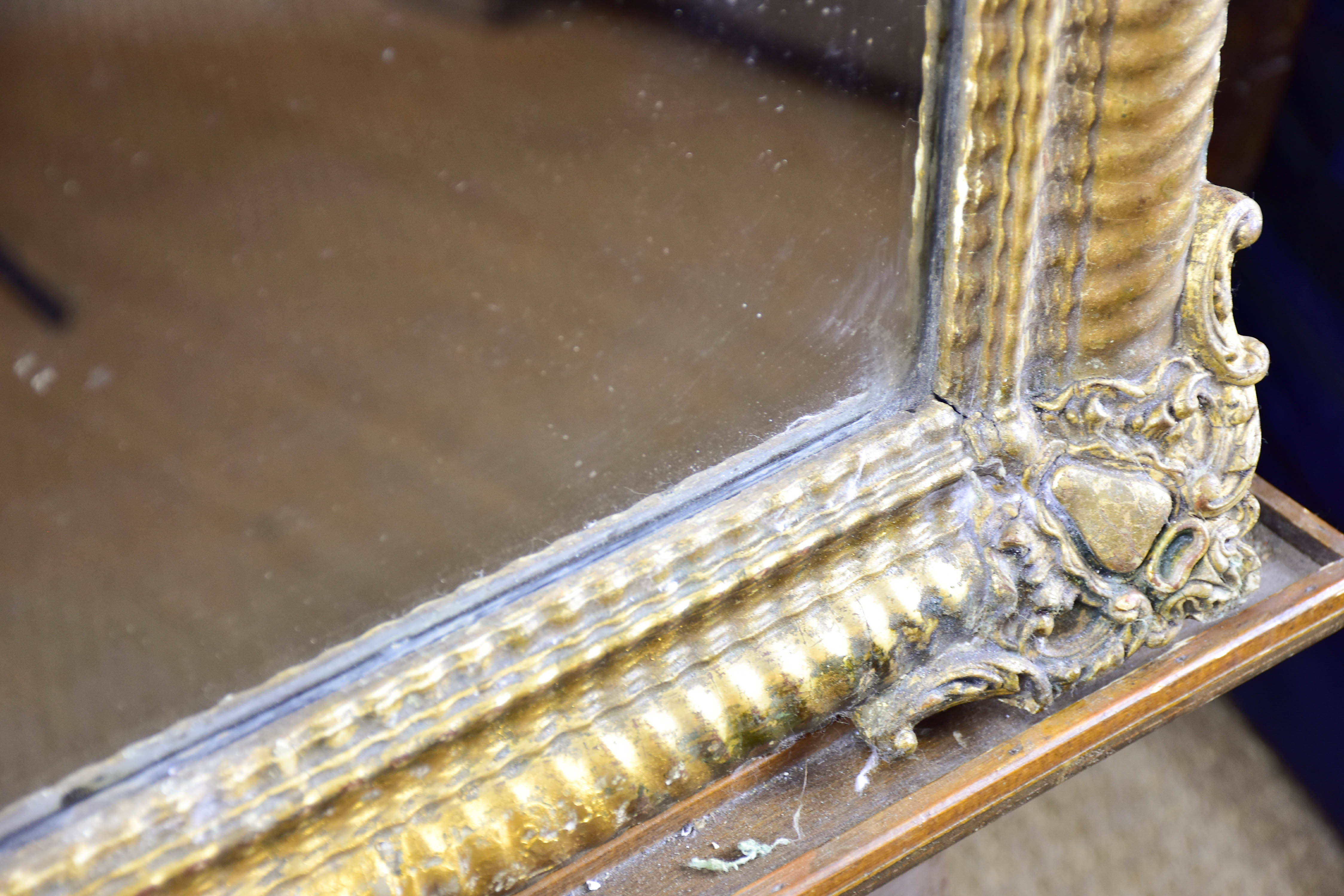 Antique French mirror with gold gadrooned frame