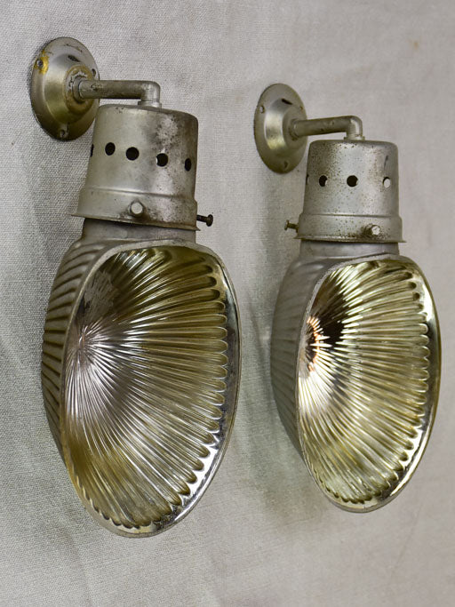 Pair of mid century holophane wall sconces from a boutique