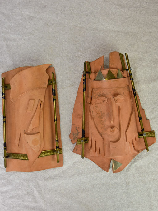 Pair of vintage handmade terracotta tile wall sconces with faces 11¾"