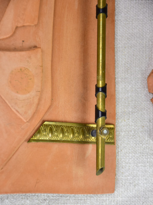 Pair of vintage handmade terracotta tile wall sconces with faces 11¾"