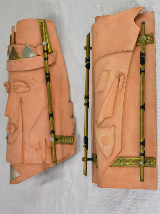 Pair of vintage handmade terracotta tile wall sconces with faces 11¾"