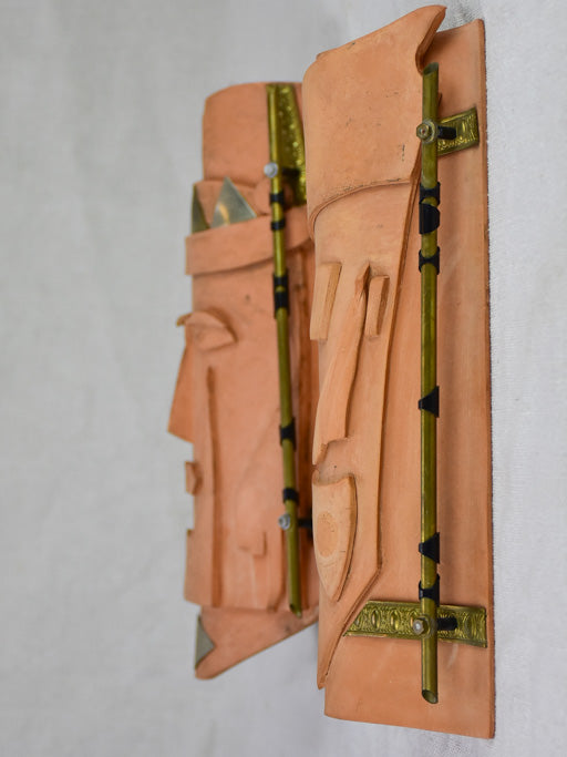 Pair of vintage handmade terracotta tile wall sconces with faces 11¾"
