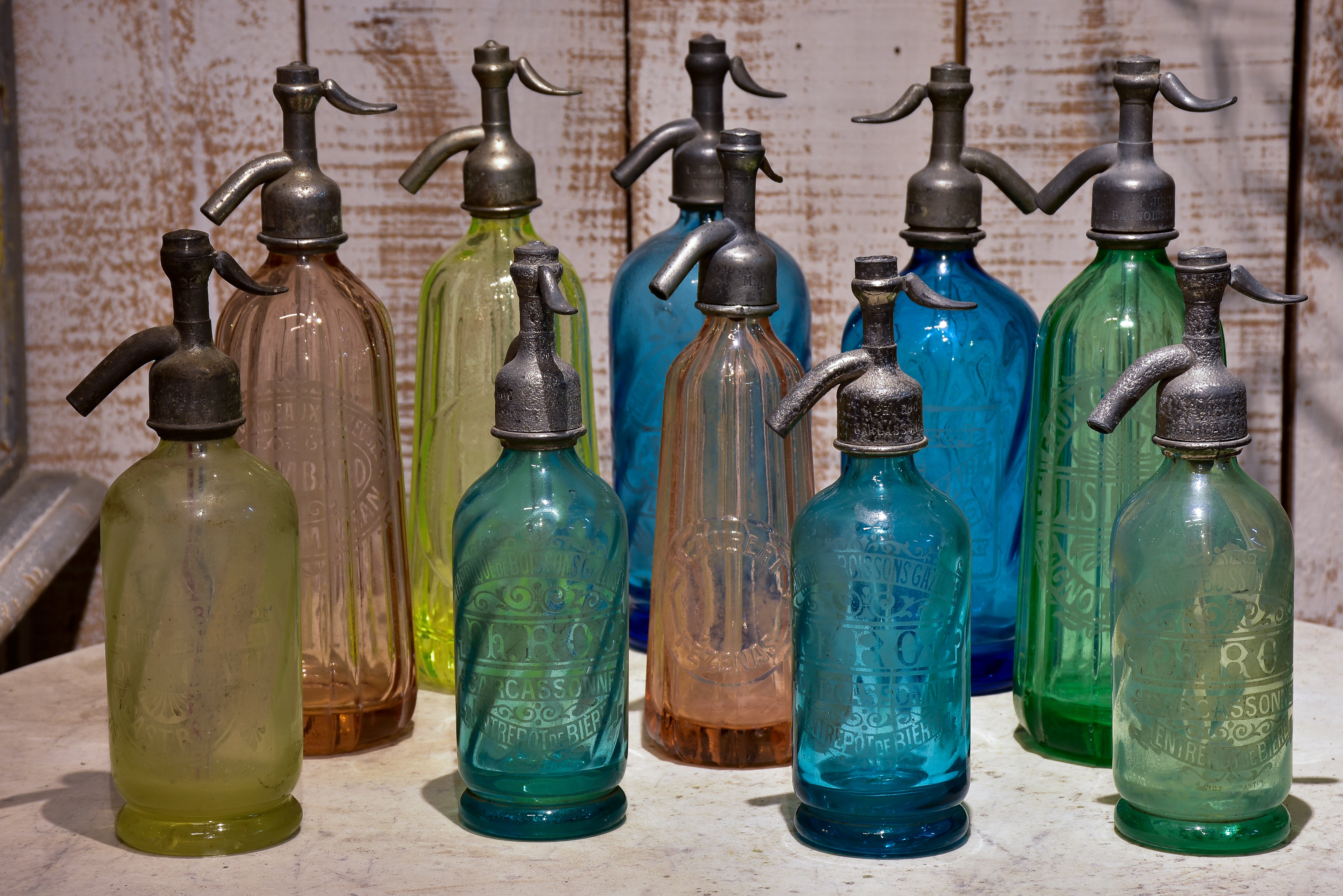 Collection of 10 antique seltzer bottles