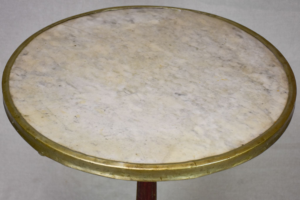 Pretty early twentieth century French bistro table with marble top and cast iron base