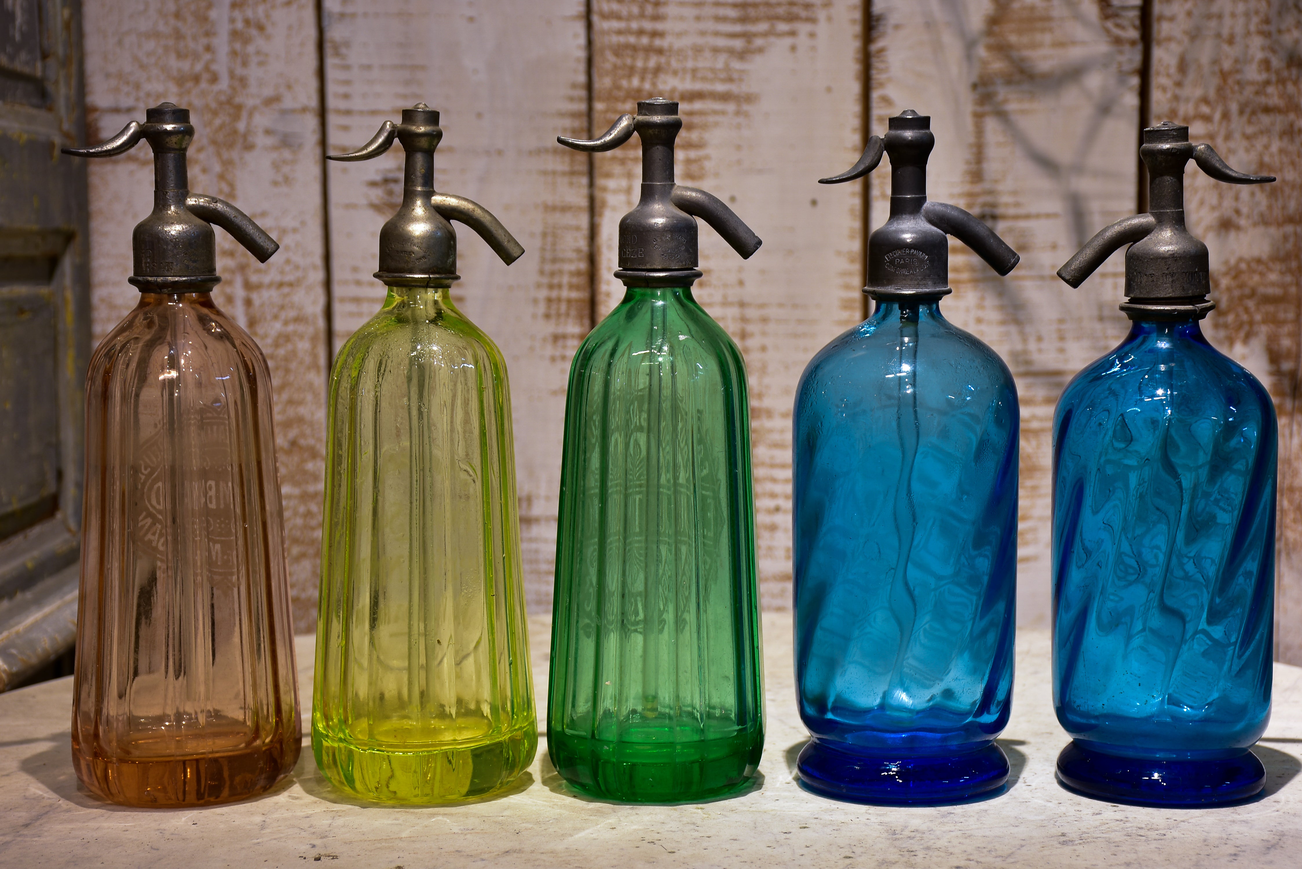 Collection of 10 antique seltzer bottles