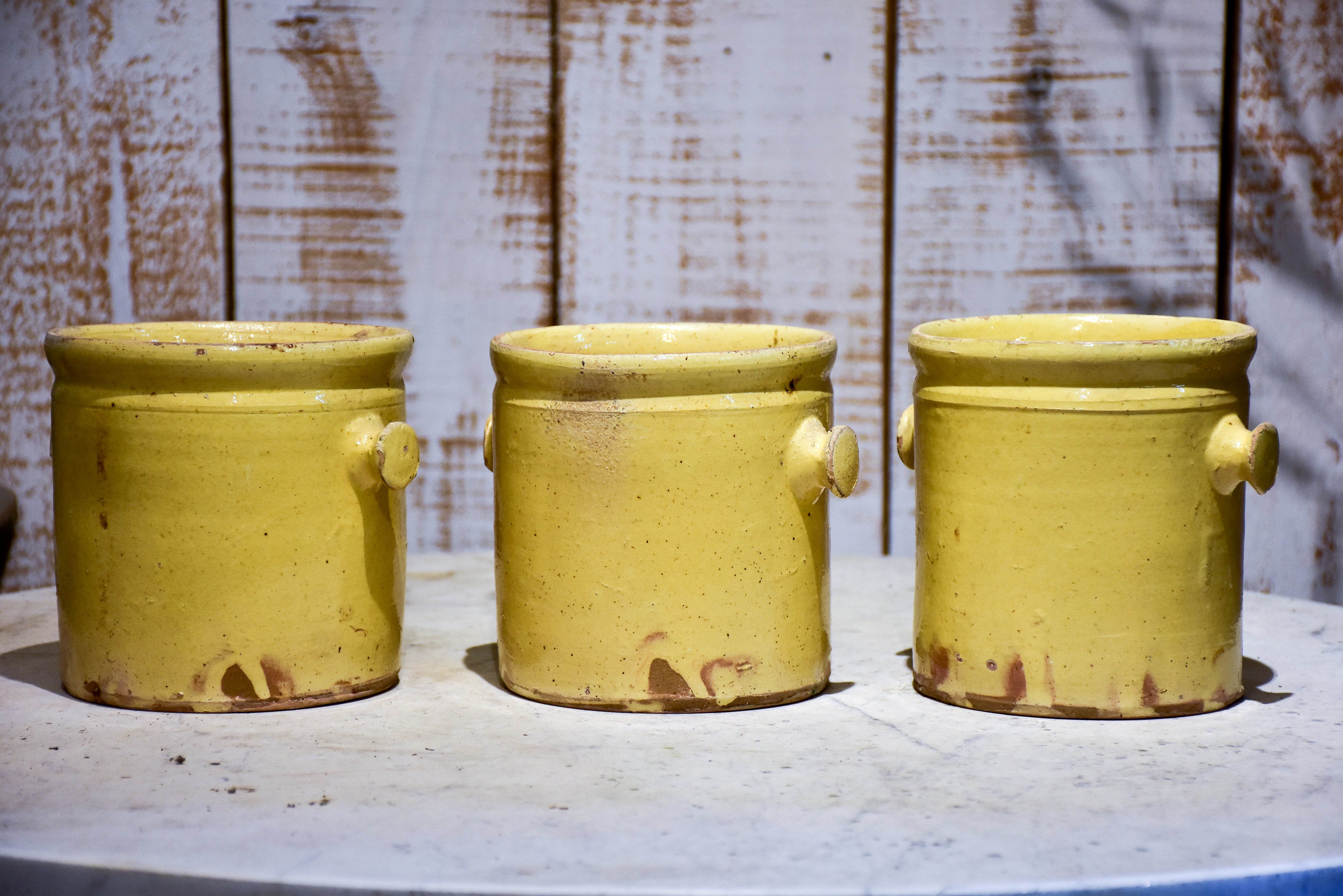 Set of three yellow glazed French pots
