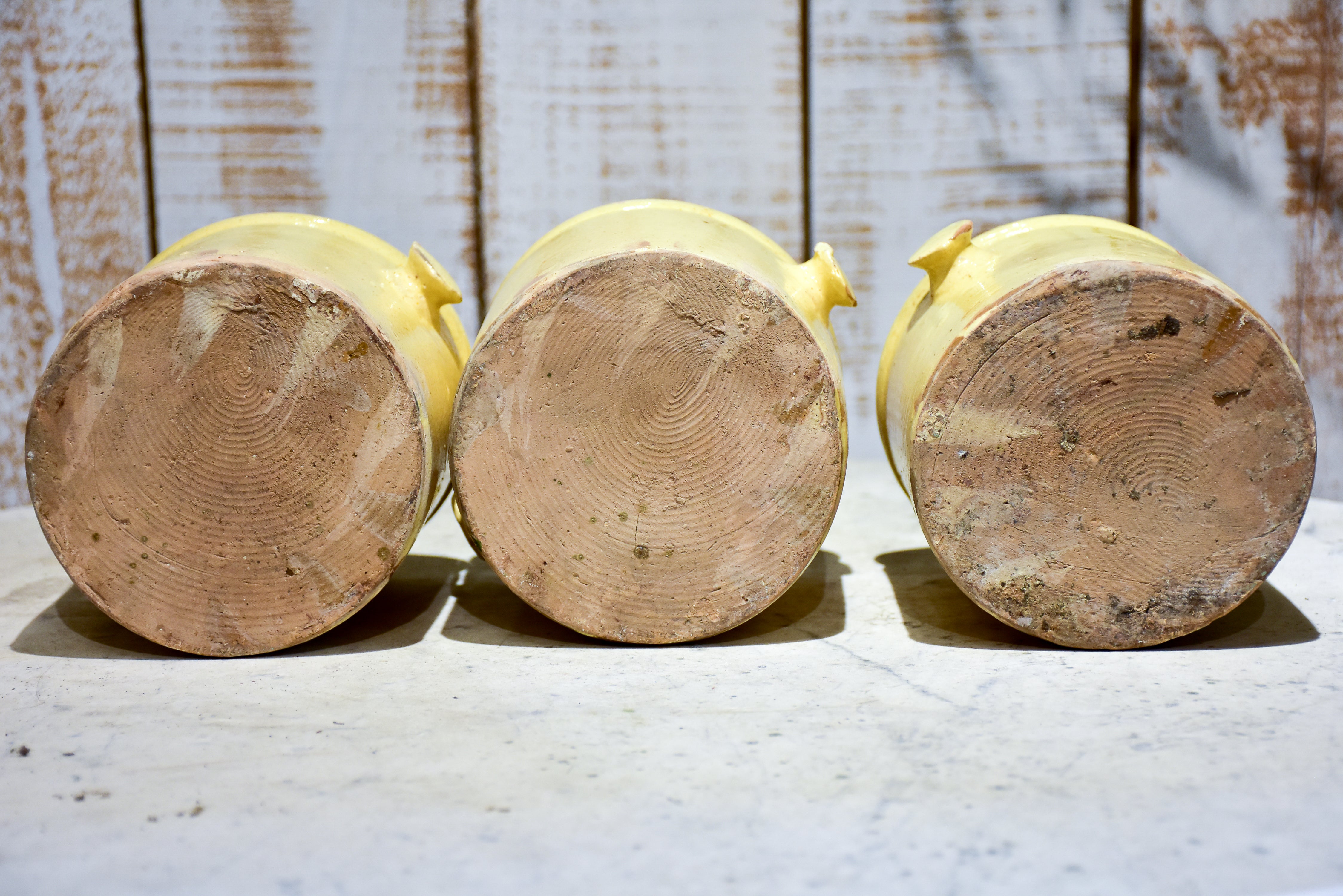 Set of three yellow glazed French pots