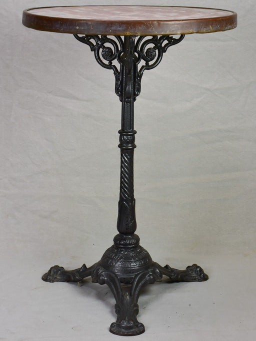Pretty red marble and cast iron bistro table from the early 20th century