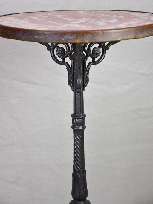 Pretty red marble and cast iron bistro table from the early 20th century