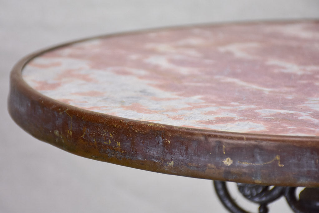 Pretty red marble and cast iron bistro table from the early 20th century