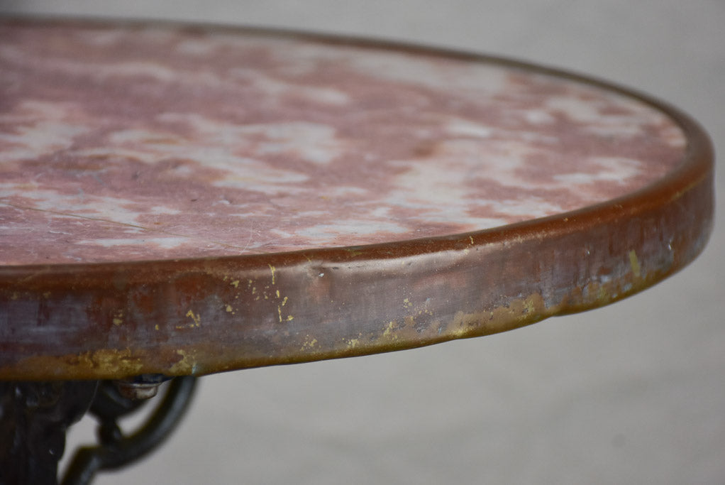Pretty red marble and cast iron bistro table from the early 20th century