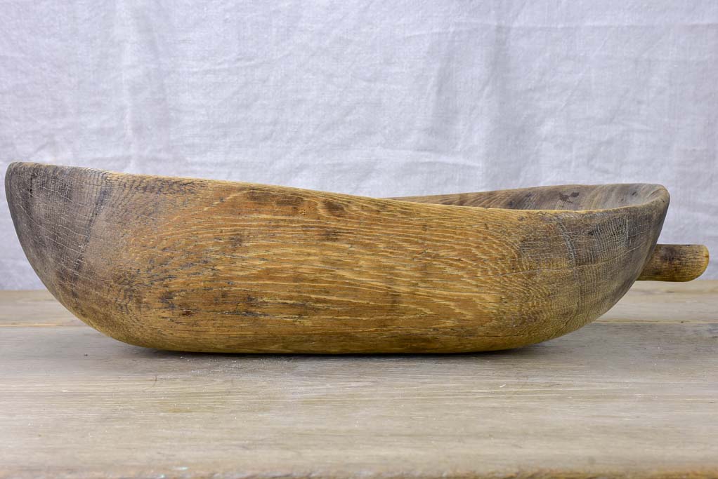 Primitive oval wooden recipient bowl with repairs 18" x 8¼"
