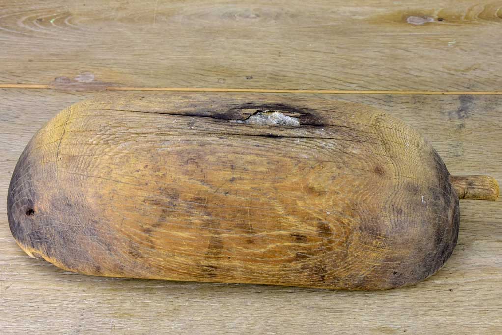 Primitive oval wooden recipient bowl with repairs 18" x 8¼"