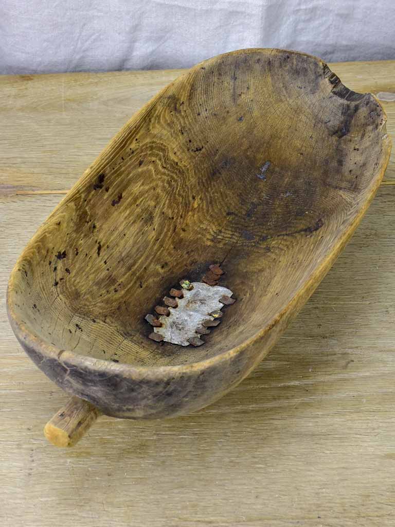 Primitive oval wooden recipient bowl with repairs 18" x 8¼"