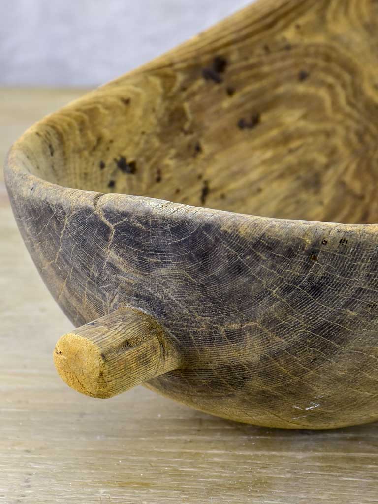Primitive oval wooden recipient bowl with repairs 18" x 8¼"