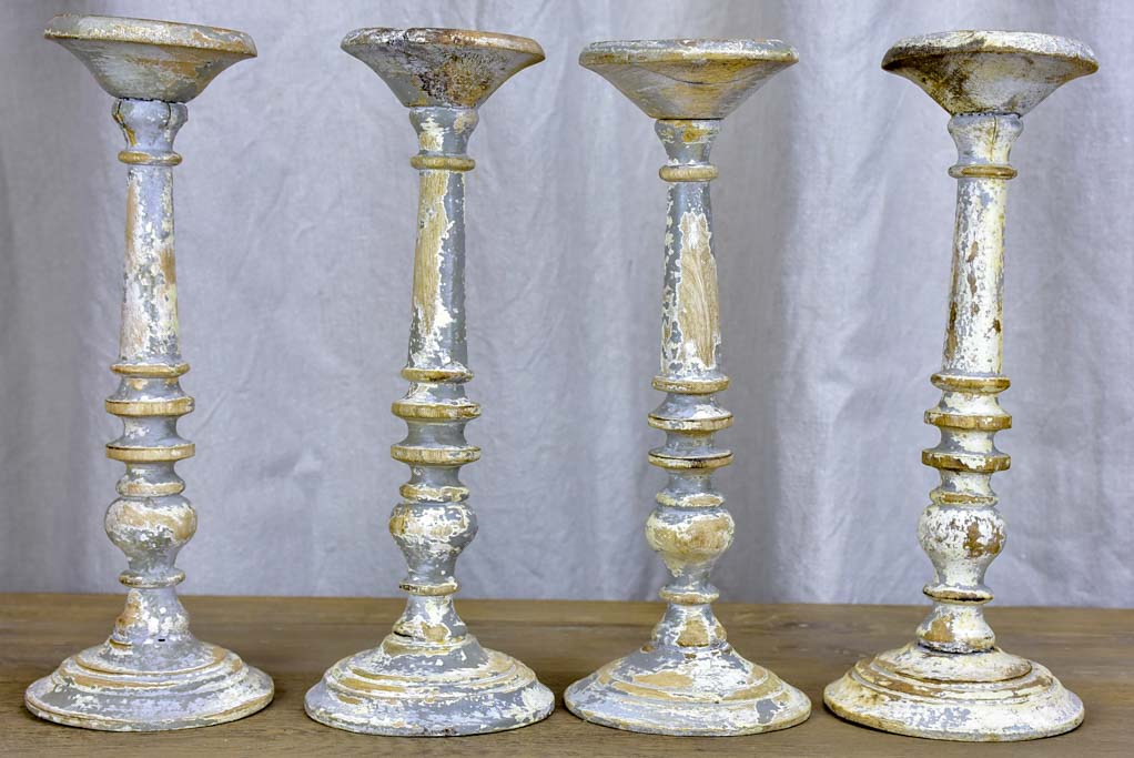 Collection of four rustic vintage candlesticks