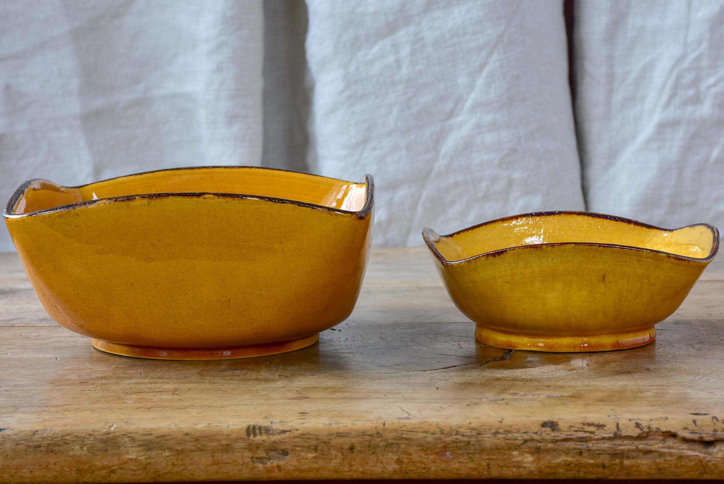 Two vintage Dieulefit bowls with ochre glaze
